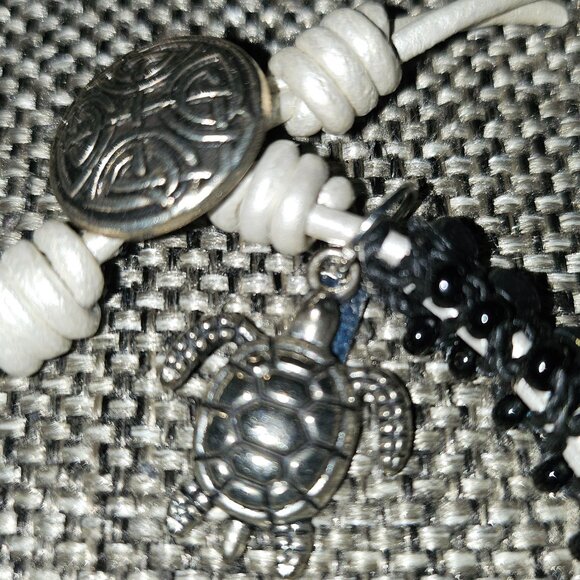 Bracelet with Rhinestones Set in Black Beads with White Tie and Turtle Charm - Picture 6 of 9